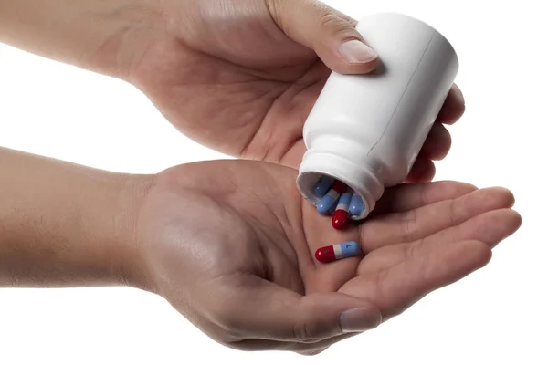 Egy kézzel gyógyszert tabletta — Stock Fotó