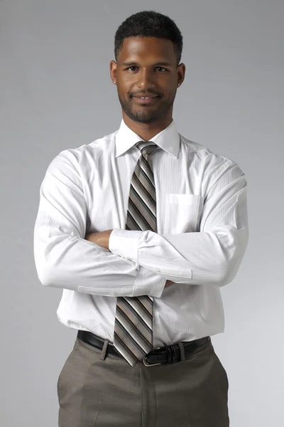 A happy businessman with arm crossed — Stock Photo, Image