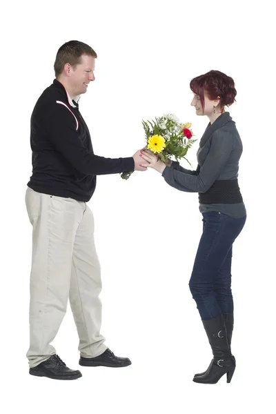 A man giving flowers to his wife — Stock Photo, Image