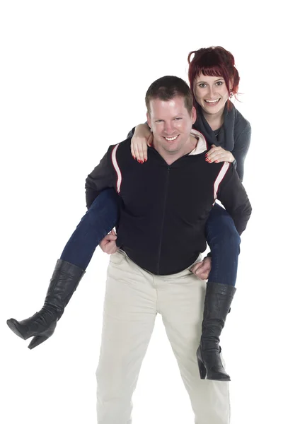 A man giving his girlfriend a piggy back ride — Stock Photo, Image