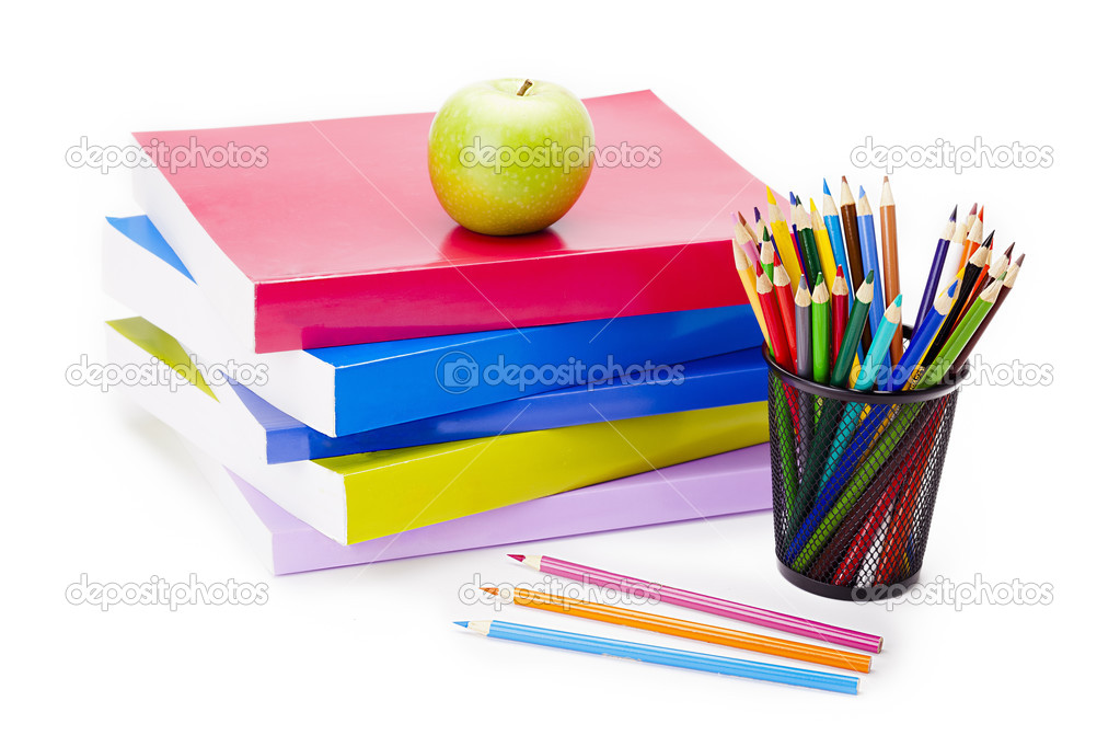 a green apple on school books