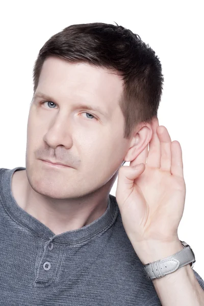 A mature man holding his ear — Stock Photo, Image