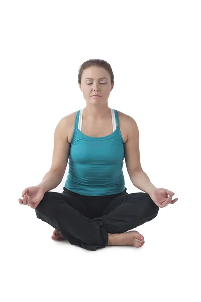 A mature woman meditating — Stock Photo, Image