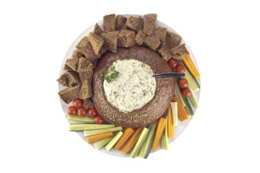 a plate with pumpernickel bread and spinach dip clipart