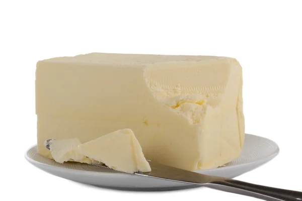Een bord met romige boter — Stockfoto