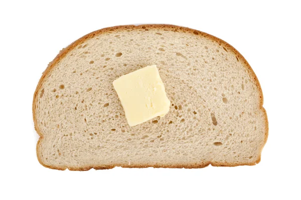 Una rebanada de pan con mantequilla derretida — Foto de Stock