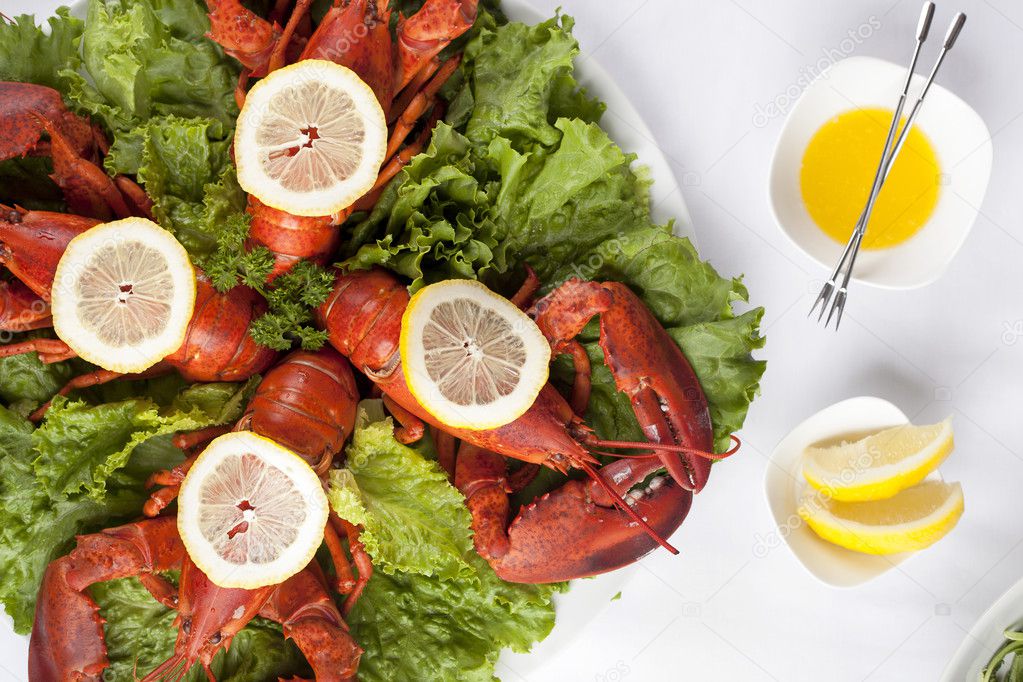 a plate with salad and lobsters