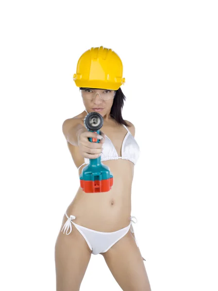 Uma mulher sexy trabalhador da construção com uma arma de parafuso — Fotografia de Stock