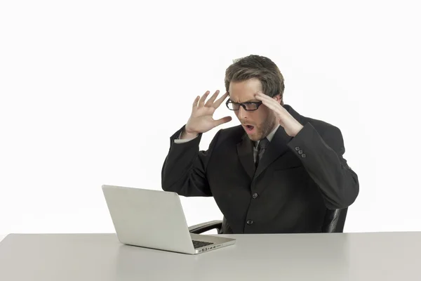 A shocked office employee looking at his laptop — Stock Photo, Image