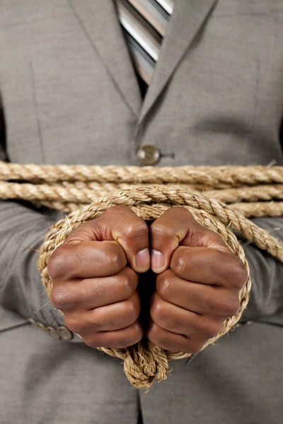 Business hands tied with rope — Stock Photo, Image