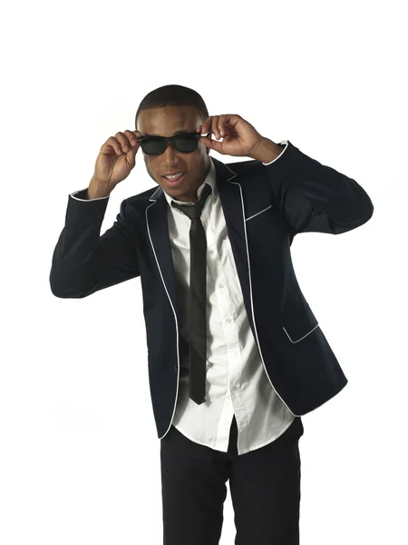 A smiling businessman adjusting sunglasses — Stock Photo, Image