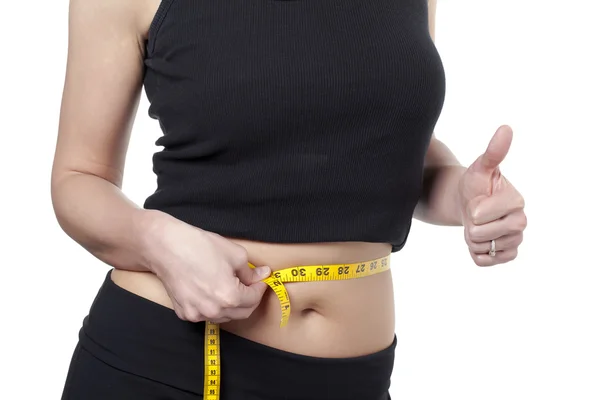 A woman satisfied measuring her waist — Stock Photo, Image