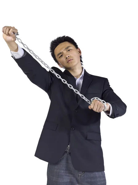 A young businessman holding a chain — Stock Photo, Image