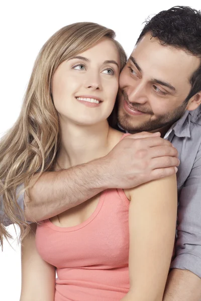 Ein junger Mann umarmt seine Frau von hinten — Stockfoto