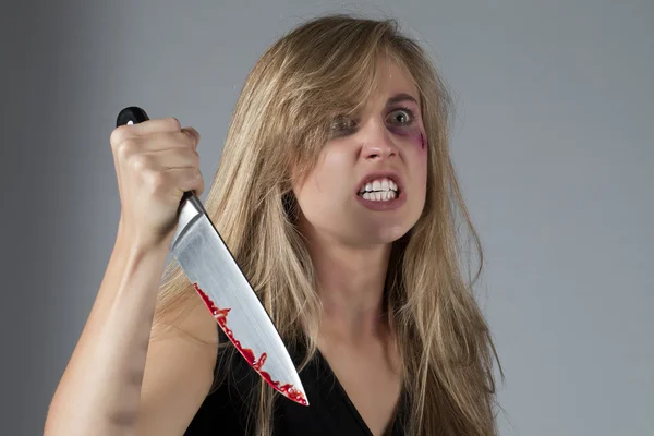 Abuse young woman holding a knife — Stock Photo, Image