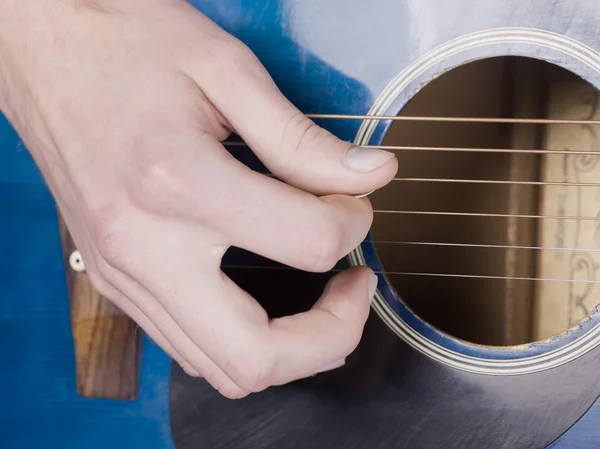 Acoustic guitar and hand — Stock Photo, Image