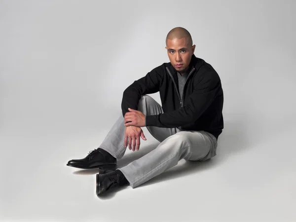 African american businessman sitting on floor — Stock Photo, Image