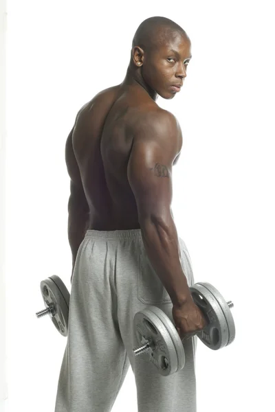 African american man with dumbbell looking at camera — Stock Photo, Image