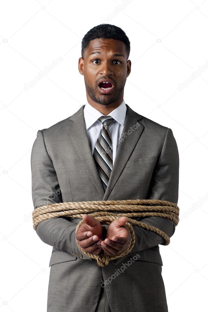 african american businessman wrapped in rope