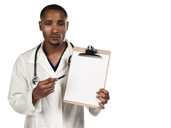 African american doctor pointing towards his clipboard — Stock Photo, Image