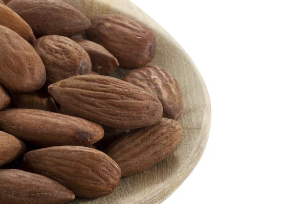 Almonds on wooden spoon close up — Stock Photo, Image