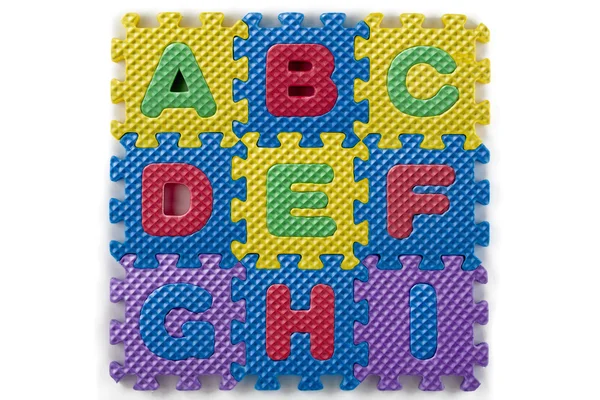 Alphabet puzzle pieces — Stock Photo, Image