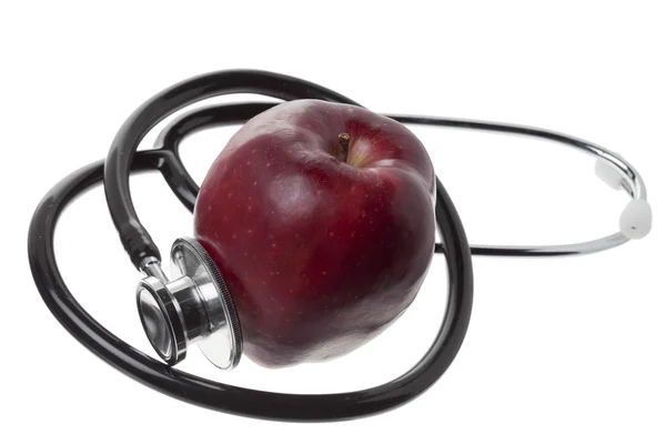 Apple and stethoscope — Stock Photo, Image