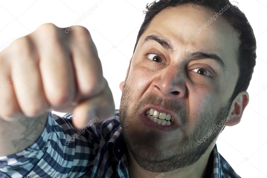 angry man punching toward the camera