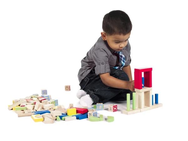 Asian kid playing with building blocks — Stock Photo, Image