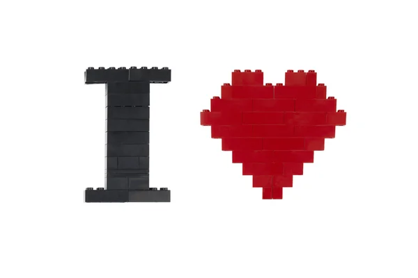 Smontované LEGO vytvořené ve tvaru slova a srdce — Stock fotografie
