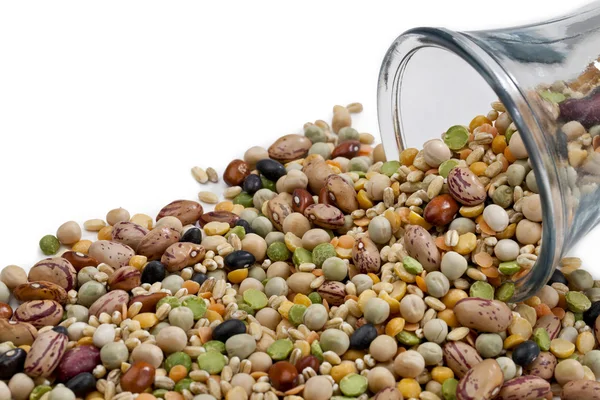 Assorted beans spilled on the jar — Stock Photo, Image