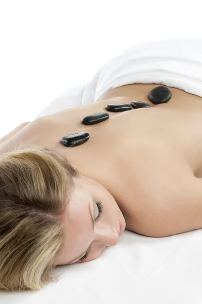 Attractive lady having stone massage — Stock Photo, Image