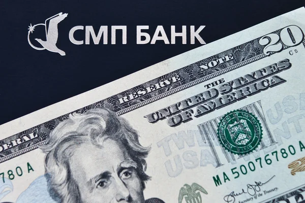 Logo of SMP bank and 20 dollar banknote — Stock Photo, Image