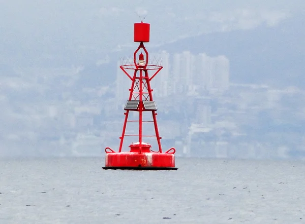 Red buoy floating . Royalty Free Stock Images