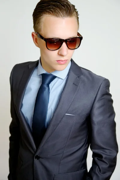 Casual Businessman wearing sunglasses looking cool — Stock Photo, Image