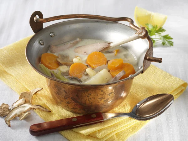 Tarragon pheasant soup in cauldron — Stock Photo, Image