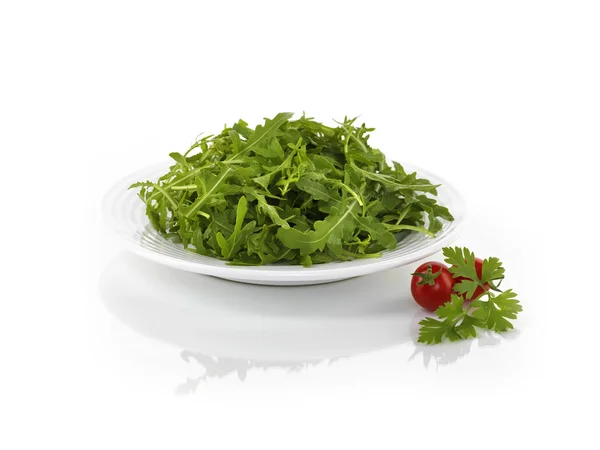 Ruccola on white plate — Stock Photo, Image