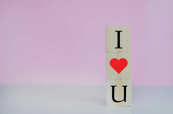Wooden Cubes Love Symbol Heart Pink Background Copy Space — стоковое фото