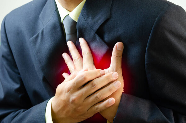 businessman has chest pain from work and anxiety.