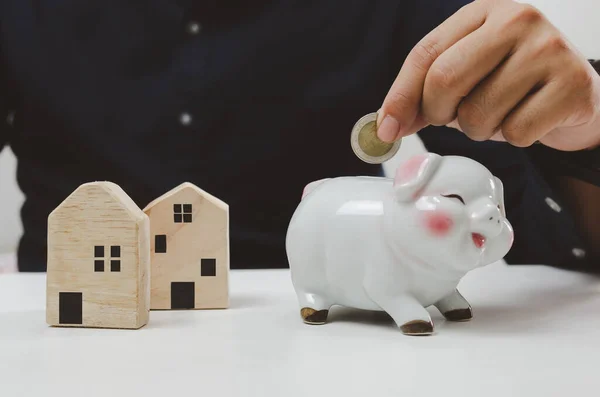 Hand Holding Coin Saving Piggy Bank Finance Investment Loan House — Φωτογραφία Αρχείου