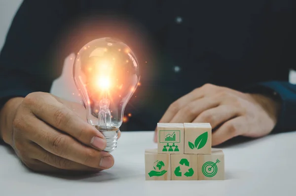 Hand Man Holding Bulb Light Wood Cube Green Eco Environmental — Fotografia de Stock