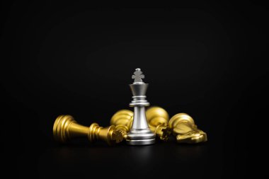 Chess game gold and silver on black background.