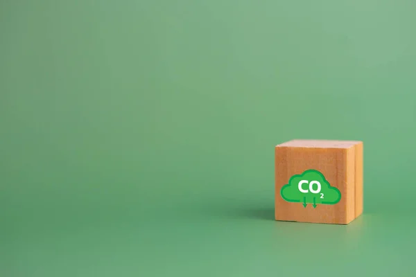 Net zero and carbon credit with wood cube block icon co2 eco on green background.