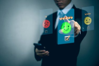 Customer service evaluation smiley face emoticon five star on virtual touch screen.business digital marketing technology concept.