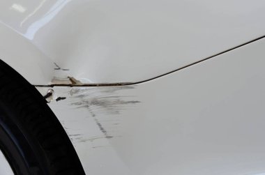 White car accident with abrasions. Concept car insurance business.