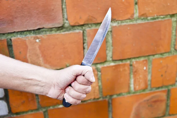 Knife in a hand — Stock Photo, Image