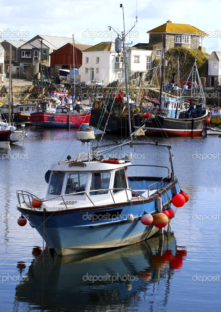 Colorful fishing boats at anchor in Mevagissey fishing village