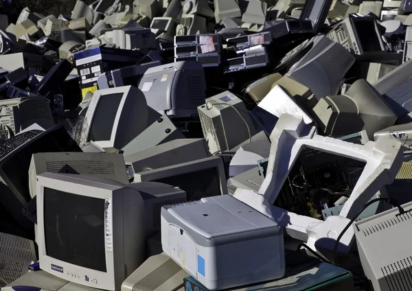 Computers and monitors piled up for recycling — Stock Photo, Image