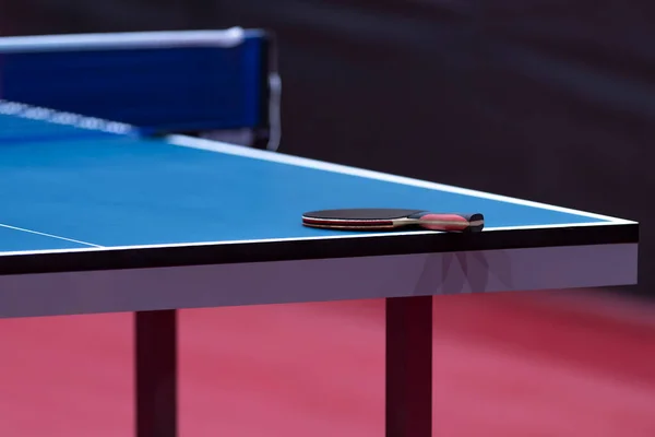 Professional blue table tennis table and racket. Horizontal sport theme poster, greeting cards, headers, website and app