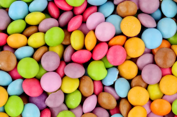 Vollmilch Schokolade Knusprige Zuckerhülle Beschichtet Bohnenkuchen Dekoration Streut Hintergrund — Stockfoto